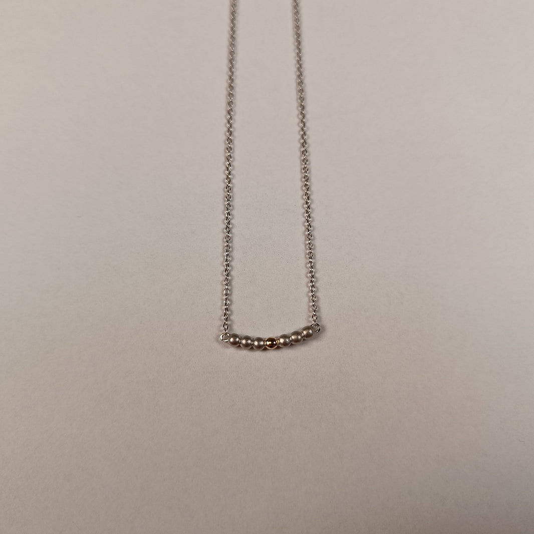 Rhod. silver necklace w/balls and 8ct. Gold