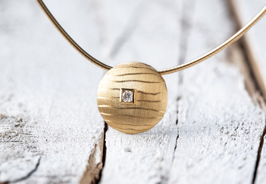 750/- Anhänger matt./Gebüstet, 0,06ct W-SI