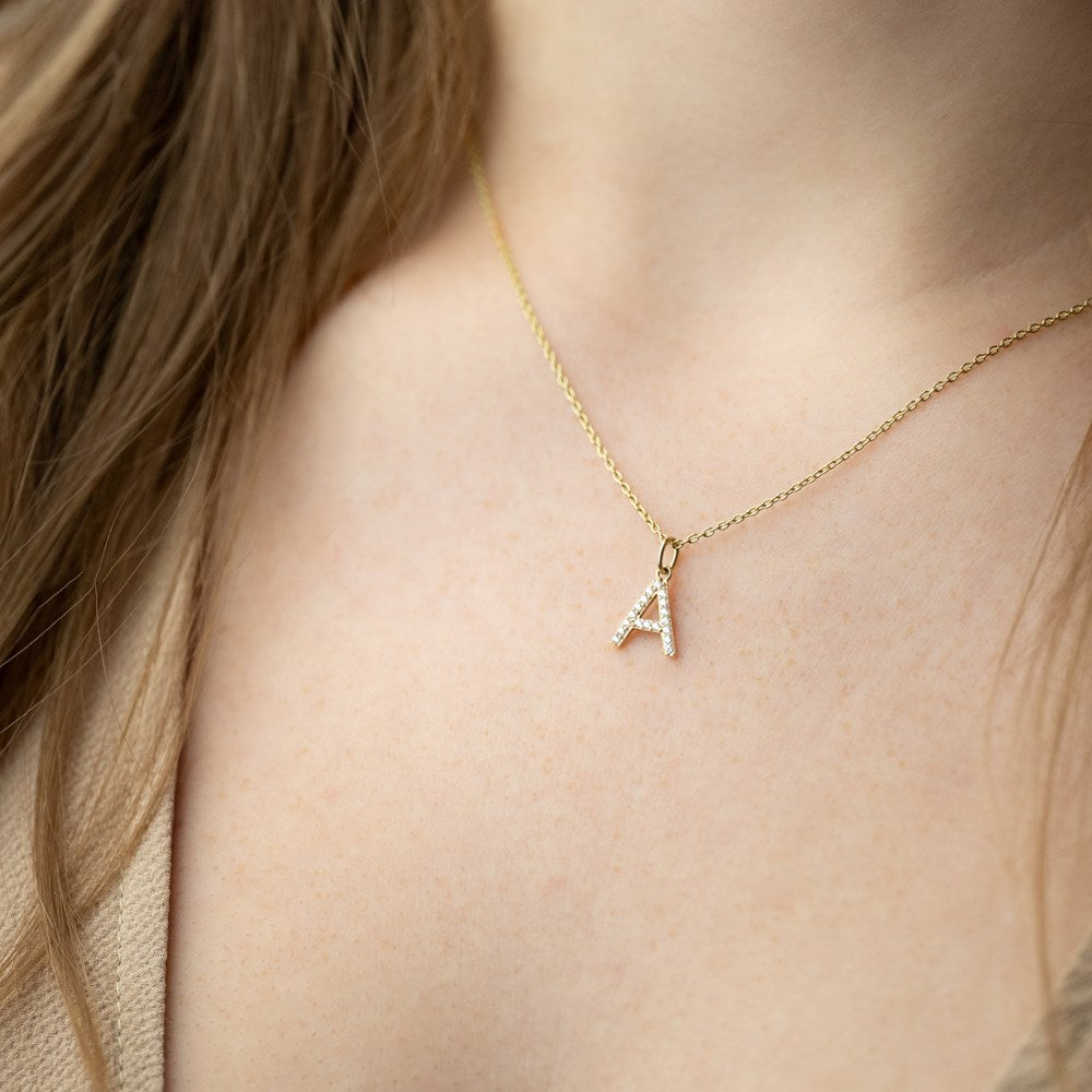 14ct. gold pendant letter w. cz.  - A