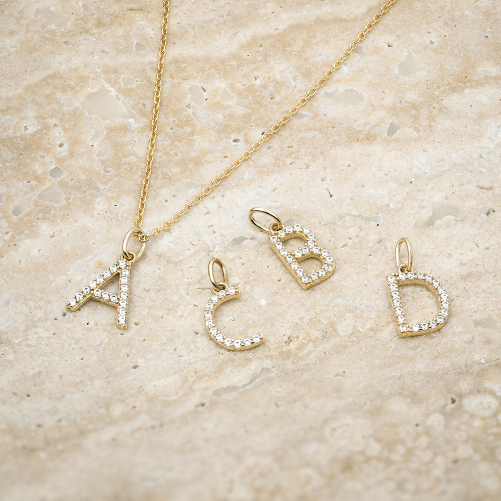 14ct. gold pendant letter w. cz.  - A