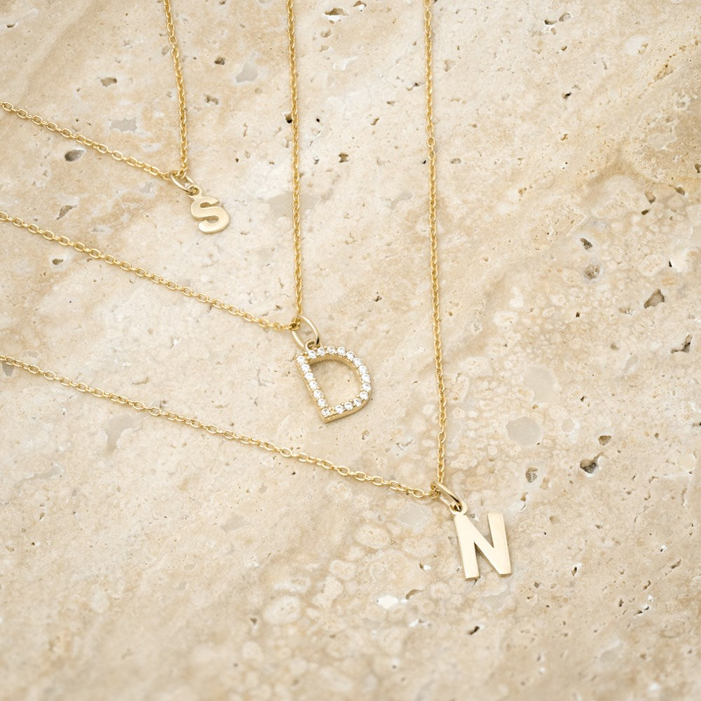 14ct. gold pendant letter w. cz.  - A